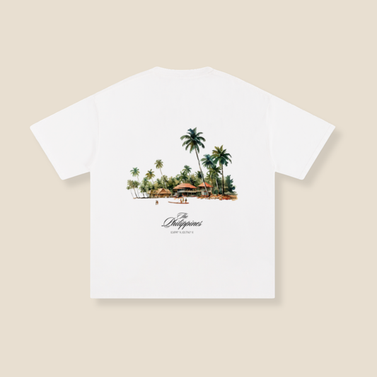 White t-shirt with a tropical island graphic and 'Philippines' text on a beige background