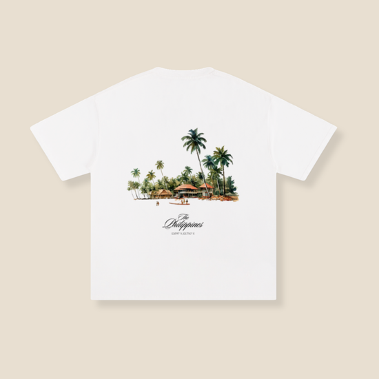 White t-shirt with a tropical island graphic and 'Philippines' text on a beige background